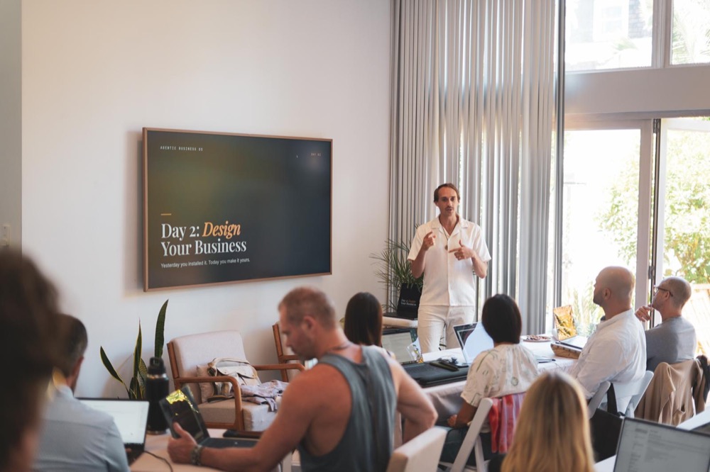 Benza teaching a full room at a past bootcamp